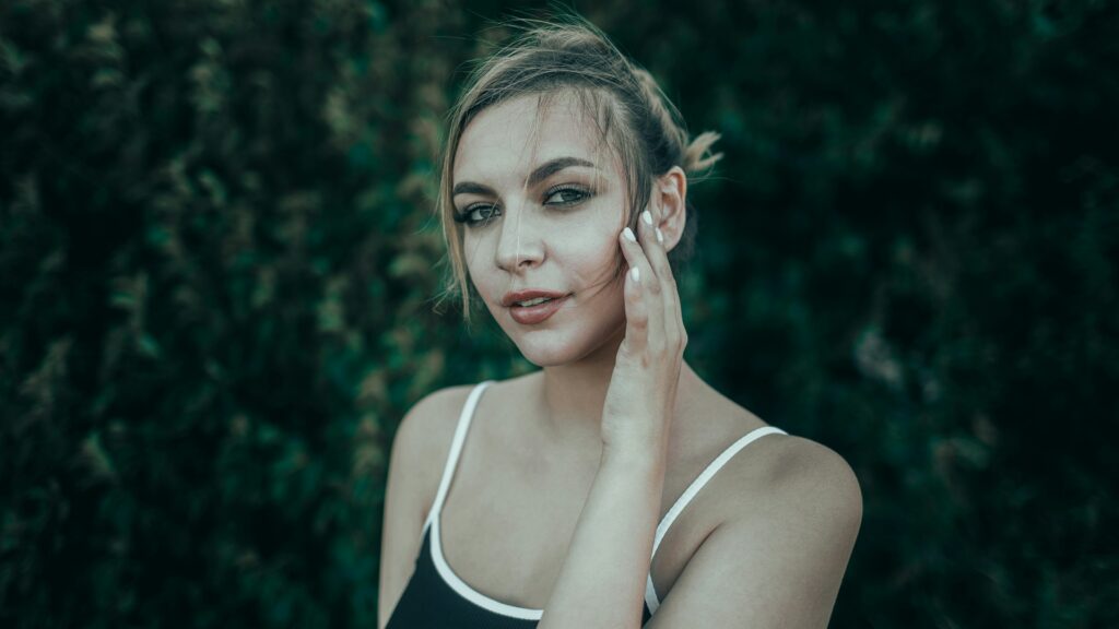a woman touching her face